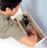 Plumber working on fixing a toilet in a home in Peoria, AZ